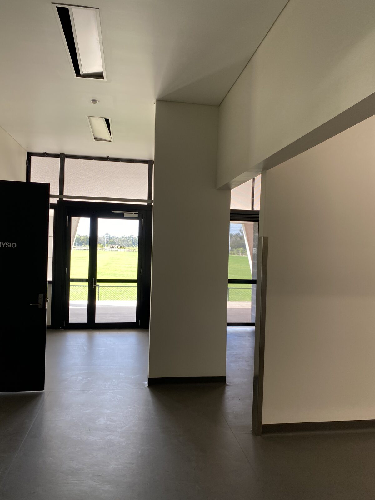 Brisbane Roar FC changeroom — corridor to physio and first aid