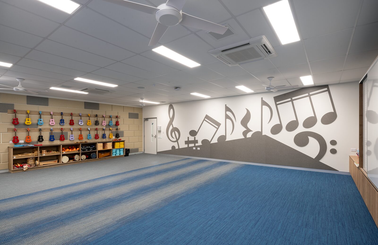 Narangba Music Hall — interior with music wall graphic